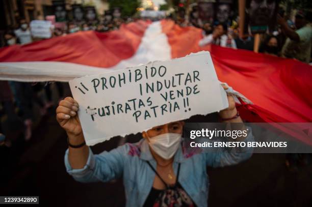 People demonstrate against the release of Peruvian former President Alberto Fujimori from prison, in Lima on March 19, 2022. - Peru's constitutional...