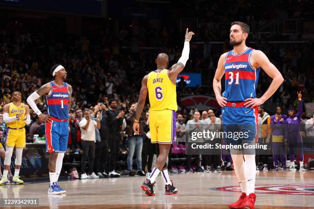 LeBron James of the Los Angeles Lakers celebrates passing Karl Malone on the NBAs all-time scoring list during the game against the Washington...