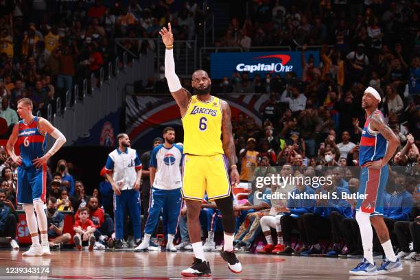 LeBron James of the Los Angeles Lakers celebrates after passing Karl Malone on the NBA all-time scoring list during the game against the Washington...