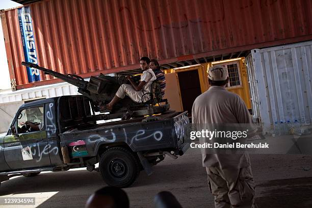 Libyan rebel soldiers arrive at the last outpost before Sirte and at an access point road to Bani Walid, from the Northern road from Misrata on...