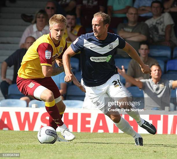 Blair Sturrock of Southend United looks to move past Byron Webster of Northampton Town during the npower League Two match between Southend United and...