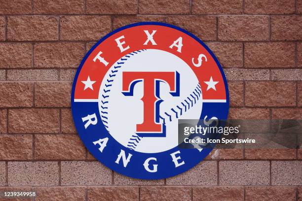 Texas Rangers sign hangs on a wall during the MLB Spring Training baseball game between the Milwaukee Brewers and the Texas Rangers on March 19, 2022...