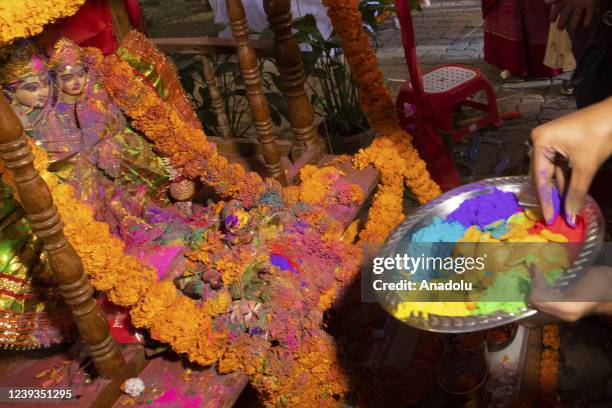 Bangladeshi people spread abir as celebration Dol Purnima festival on March 18 in Dhaka, Bangladesh.