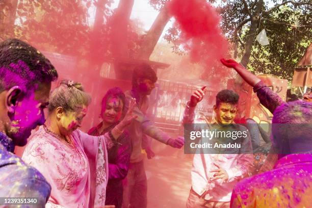 Bangladeshi people spread abir as celebration Dol Purnima festival on March 18 in Dhaka, Bangladesh.
