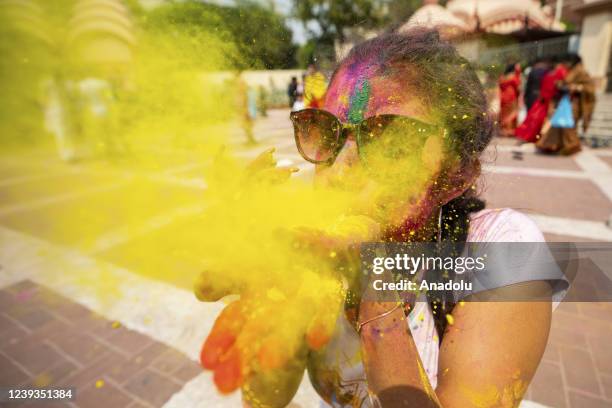 Bangladeshi people spread abir as celebration Dol Purnima festival on March 18 in Dhaka, Bangladesh.