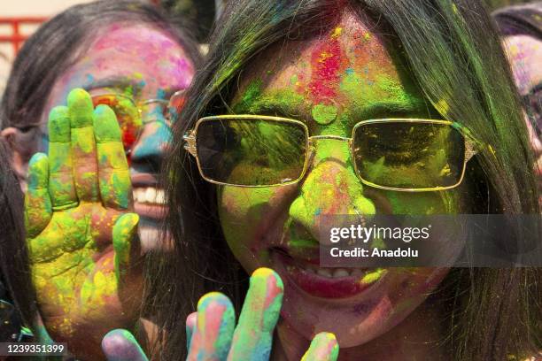 Bangladeshi people spread abir as celebration Dol Purnima festival on March 18 in Dhaka, Bangladesh.