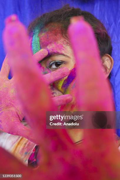 Bangladeshi people spread abir as celebration Dol Purnima festival on March 18 in Dhaka, Bangladesh.