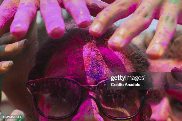 Bangladeshi people spread abir as celebration Dol Purnima festival on March 18 in Dhaka, Bangladesh.