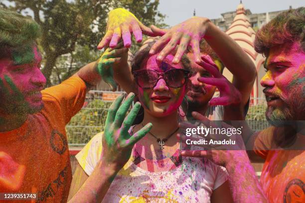 Bangladeshi people spread abir as celebration Dol Purnima festival on March 18 in Dhaka, Bangladesh.