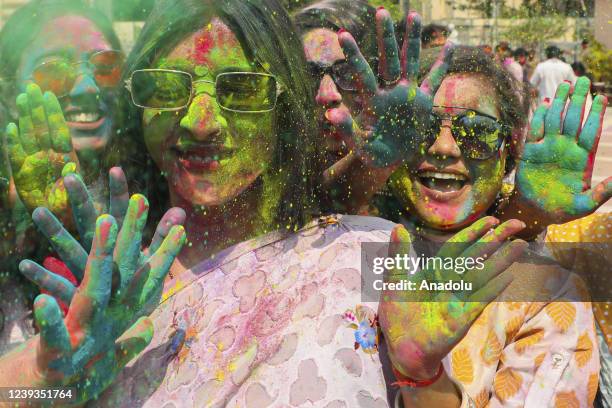 Bangladeshi people spread abir as celebration Dol Purnima festival on March 18 in Dhaka, Bangladesh.