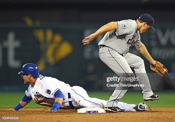 Left fielder Alex Gordon of the Kansas City Royals steals second base as second baseman Cord Phelps the Cleveland Indians attempts to tag him at...