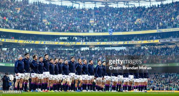Dublin , Ireland - 19 March 2022; The Scotland team stand for the national anthems before the Guinness Six Nations Rugby Championship match between...