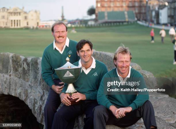 Ronan Rafferty , David Feherty and Philip Walton representing Ireland celebrate with the trophy after winning the Dunhill Nations Cup at the Old...