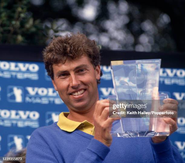 Mike Harwood of Australia celebrates with the trophy after winning the Volvo Masters at Valderrama Golf Club on October 28, 1990 in San Roque, Spain.