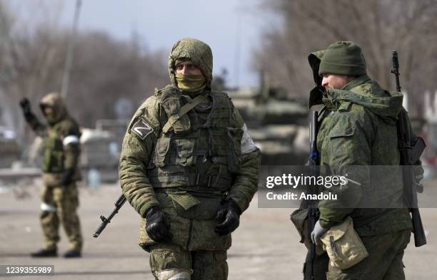 Security forces are seen as civilians trapped in Mariupol city under Russian attacks, are evacuated in groups under the control of pro-Russian...