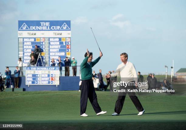 David Feherty representing Ireland celebrates after winning on the 3rd extra hole as he is congratulated by Howard Clark of England after the Dunhill...