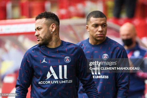 Paris Saint-Germain's Brazilian forward Neymar and Paris Saint-Germain's French forward Kylian Mbappe warm up ahead of the French L1 football match...