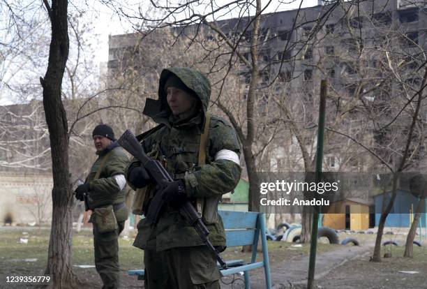 Pro-Russian separatists are seen as civilians trapped in Mariupol city under Russian attacks, are evacuated in groups under the control of...