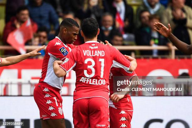 Monaco's German forward Kevin Volland celebrates with teammates after scoring the second goal during the French L1 football match between AS Monaco...