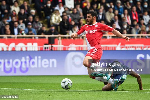 Paris Saint-Germain's French defender Presnel Kimpembe fouls Monaco's German forward Kevin Volland resulting in a penalty during the French L1...