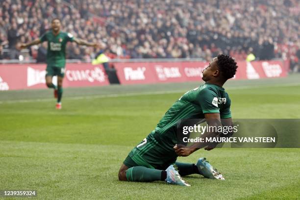 Feyenoord's Belgium forwars Cyriel Dessers celebrates with teammate Colombian forward Sinisterra as they celebrate a goal during the Dutch Eredivisie...