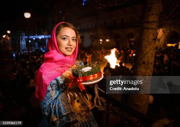 People wearing traditional clothes gather during the spring festival of Nowruz to celebrate in the old city, Icherisheher, Baku, Azerbaijan on March...