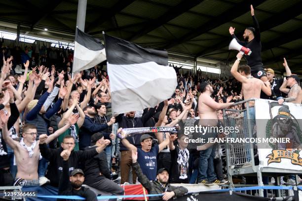Angers' Moroccan midfielder Sofiane Boufal applauds Angers' supporters after the team beat Brest 1-0 in the French L1 football match between SCO...