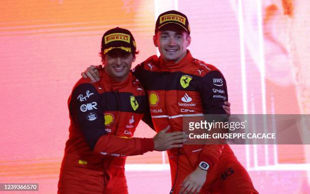 Winner Ferrari's Monegasque driver Charles Leclerc and second place Ferrari's Spanish driver Carlos Sainz Jr celebrate on the podium after the...
