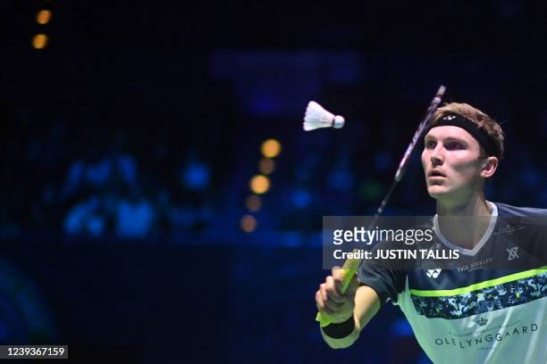 Denmark's Viktor Axelsen returns the shuttlecock to India's Lakshya Sen during the men's singles final at the All England Open Badminton Championship...