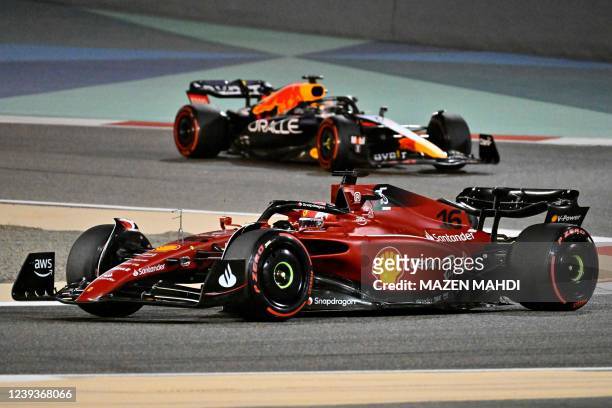 Ferrari's Monegasque driver Charles Leclerc and Red Bull's Dutch driver Max Verstappen drive during the Bahrain Formula One Grand Prix at the Bahrain...