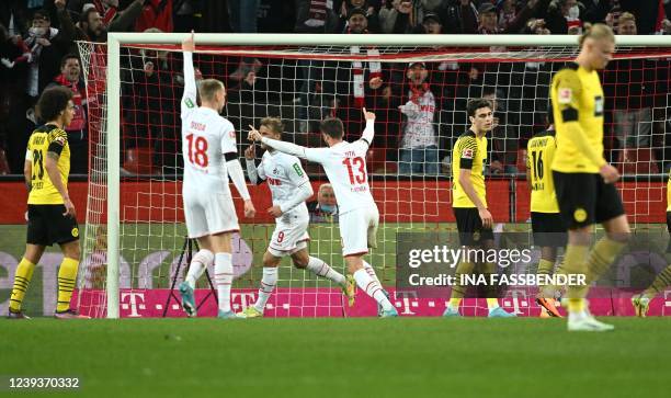 Cologne's Slovak midfielder Ondrej Duda , Cologne's Swedish forward Sebastian Andersson and Cologne's German forward Mark Uth celebrate the 1-1...