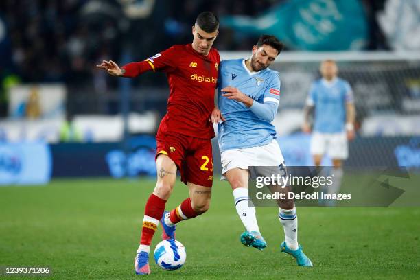 Gianluca Mancini of AS Roma and Danilo Cataldi of SS Lazio battle for the ball during the Serie A match between AS Roma and SS Lazio at Stadio...