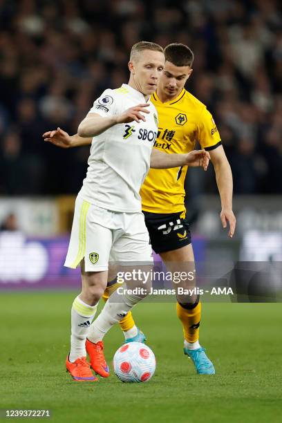 Adam Forshaw of Leeds United and Leander Dendoncker of Wolverhampton Wanderers during the Premier League match between Wolverhampton Wanderers and...