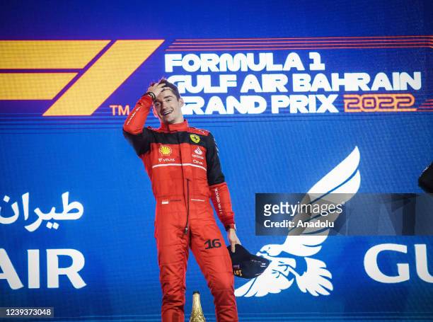 Ferrari's Monacan pilot Charles Leclerc poses after he wins Bahrain Formula One Grand Prix at the Bahrain International Circuit in Bahrain, Bahrain...