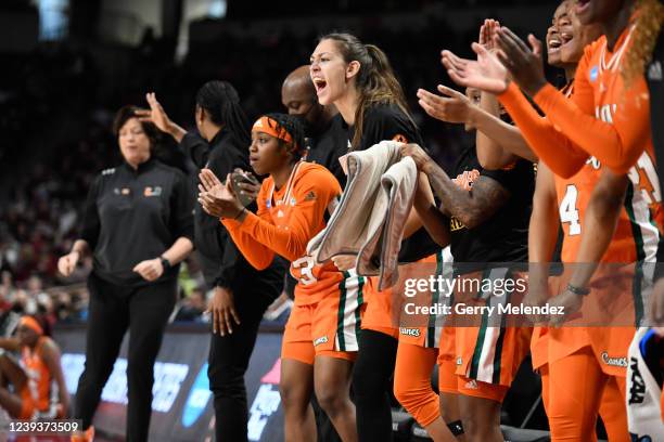 The Miami Hurricanes bench cheers on their team during the second round of the 2022 NCAA Women's Basketball Tournament held at Colonial Life Arena on...