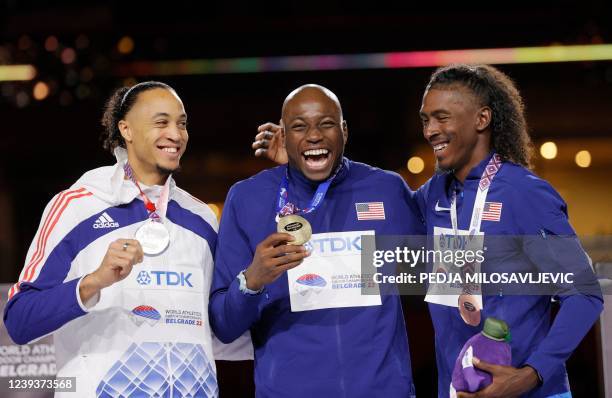 Silver medallist France's Pascal Martinot-Lagarde, gold medallist US athlete Grant Holloway and bronze medallist US athlete Jarret Eaton pose during...