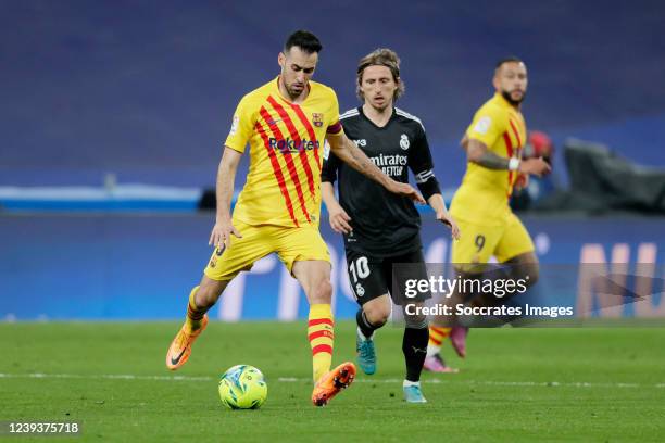 Sergio Busquets of FC Barcelona Luka Modric of Real Madrid during the La Liga Santander match between Real Madrid v FC Barcelona at the Santiago...