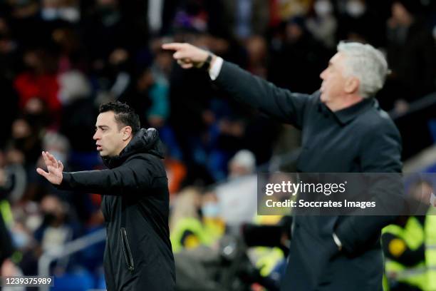 Coach Xavi Hernandez of FC Barcelona, coach Carlo Ancelotti of Real Madrid during the La Liga Santander match between Real Madrid v FC Barcelona at...