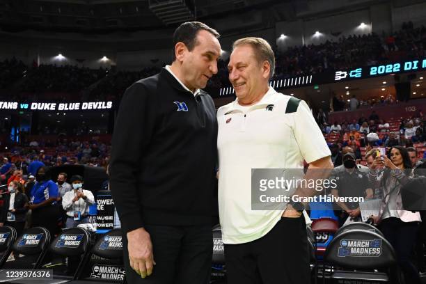 Head coach Mike Krzyzewski of the Duke Blue Devils and head coach Tom Izzo of the Michigan State Spartans talk before their game during the second...