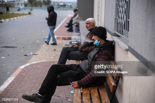 Palestinian workers wait at the Erez crossing as they prepare to leave Beit Hanun in the northern Gaza Strip. Palestinian workers leave Beit Hanun in...