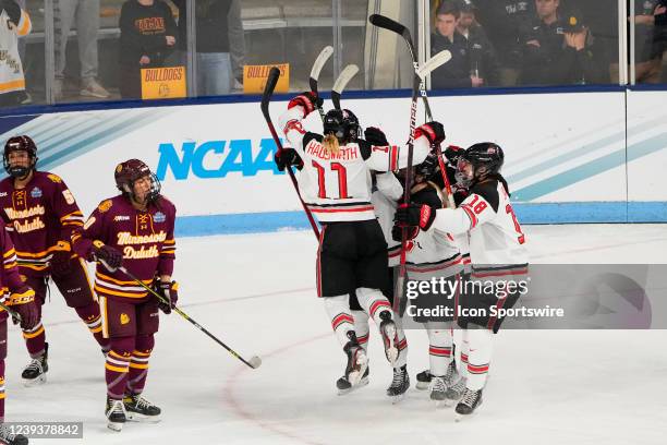 Ohio State Buckeyes Forward Kenzie Hauswirth leaps towards Ohio State Buckeyes Forward Sara Saekkinen and Ohio State Buckeyes Forward Lexi Templeman...