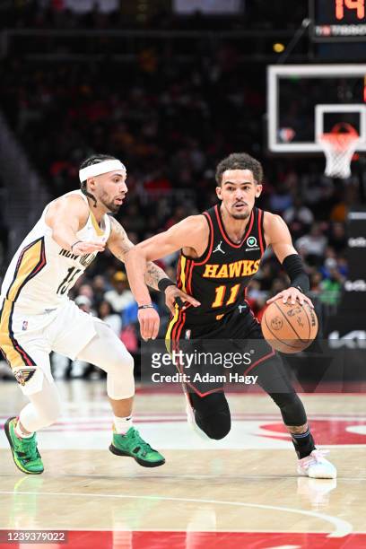 Trae Young of the Atlanta Hawks drives to the basket during the game against the New Orleans Pelicans on March 20, 2022 at State Farm Arena in...