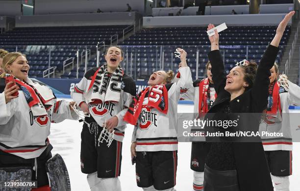 Head Coach Nadine Muzerall of the Ohio State Buckeyes celebrates after having water dumped on her after the Buckeyes defeated the Minnesota Duluth...