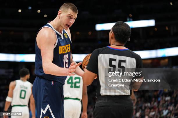 Nikola Jokic of the Denver Nuggets talks to referee Bill Kennedy at Ball Arena on March 20, 2022 in Denver, Colorado. NOTE TO USER: User expressly...
