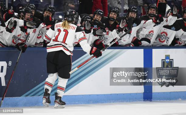 Kenzie Hauswirth of the Ohio State Buckeyes celebrates with teammates on the bench after scoring a goal in the third period during the Division I...