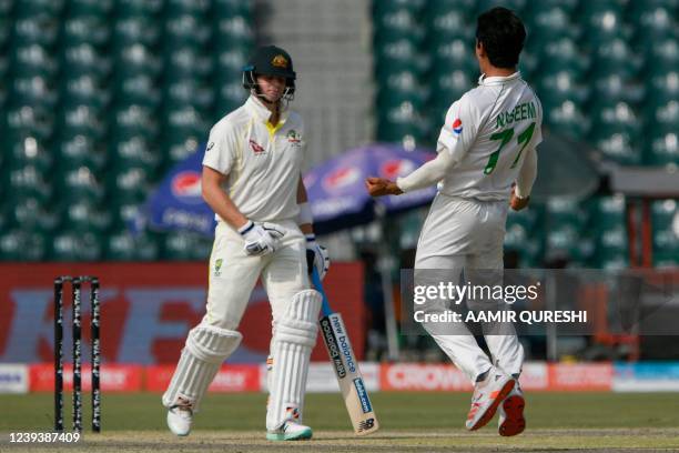 Pakistan's Naseem Shah celebrates after dismissing Australia's Steve Smith during the first day of the third cricket Test match between Pakistan and...