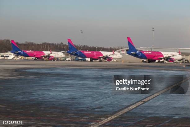 WizzAir low cost airline Airbus A321 and A321neo as seen parked at the tarmac Krakow Airport, John Paul II Kraków-Balice International. W!ZZ Air, is...