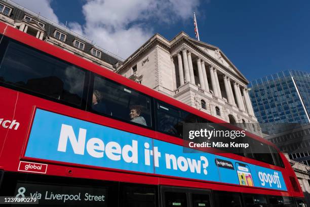 Bus passes the Bank of England with the slogan 'need it now' on an advertisement for the company Gopuff in the City of London on 18th March 2022 in...