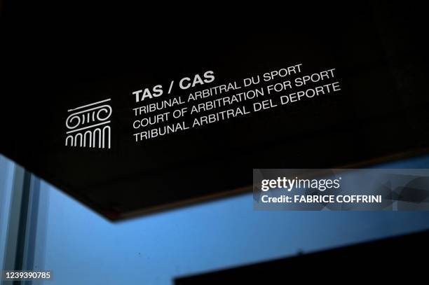 Picture taken on March 21, 2022 shows a sign and logo of the Court of Arbitration for Sport at their new headquarters in in Lausanne, western...