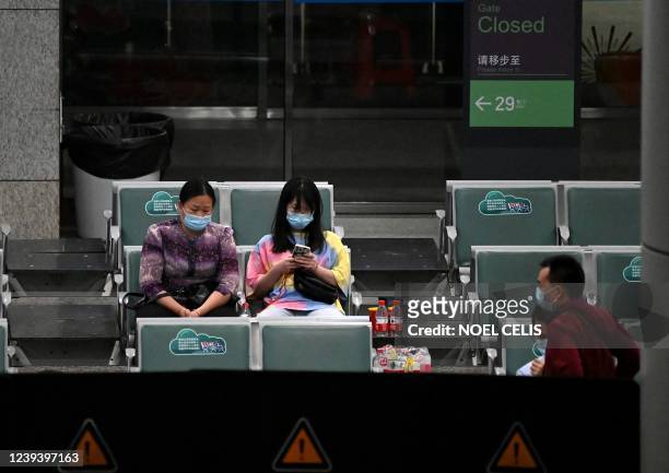 Relatives of passengers on China Eastern flight MU5375 are seen at the holding area, after the plane failed to arrive at Guangzhou Baiyun...